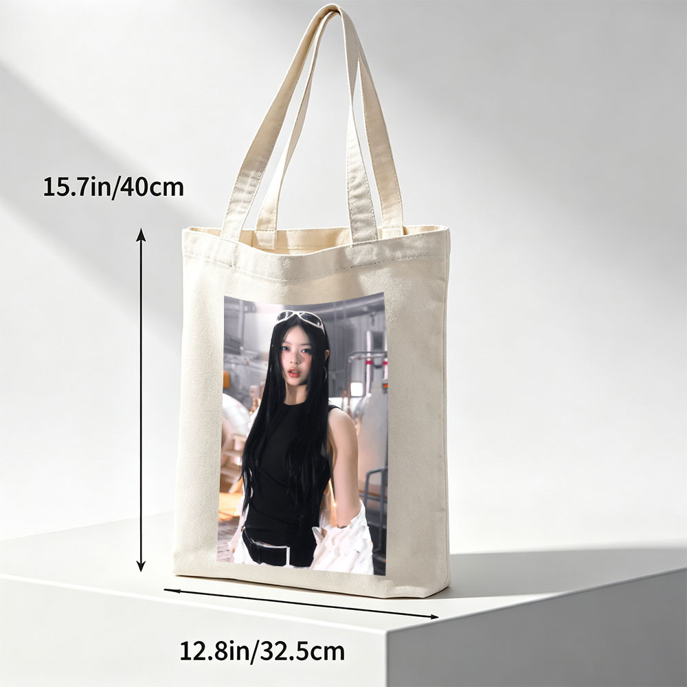Hanni of NewJeans in a Futuristic Studio Setting Wearing a Black Top and White Ruffled Skirt with Sunglasses on Head - Canvas tote bags