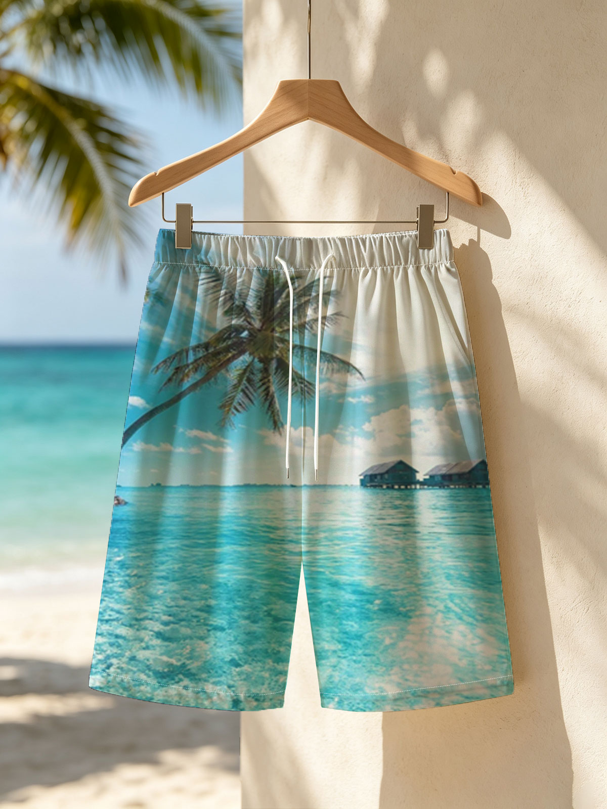 Tropical paradise with palm trees and overwater bungalows in crystal clear blue waters. -  Beach shorts