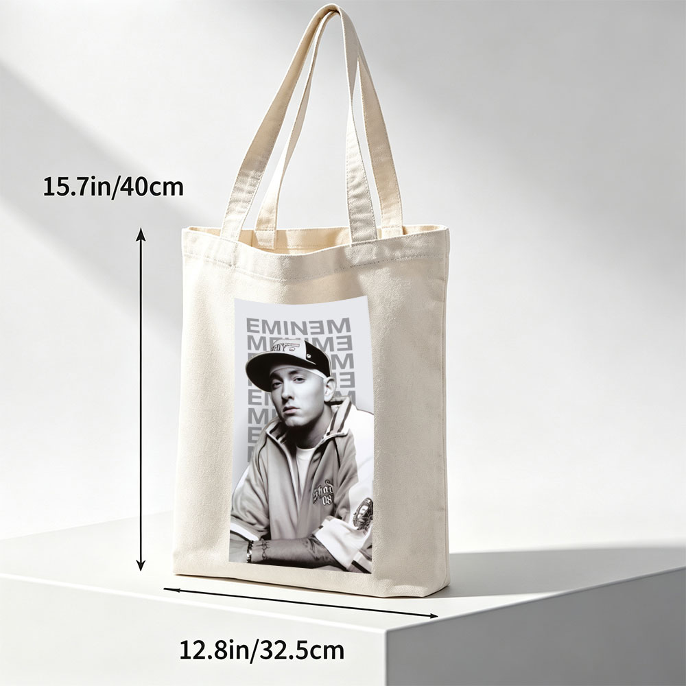 Eminem in a Casual Pose Wearing a Cap and Track Jacket with Tattooed Arms - Canvas tote bags