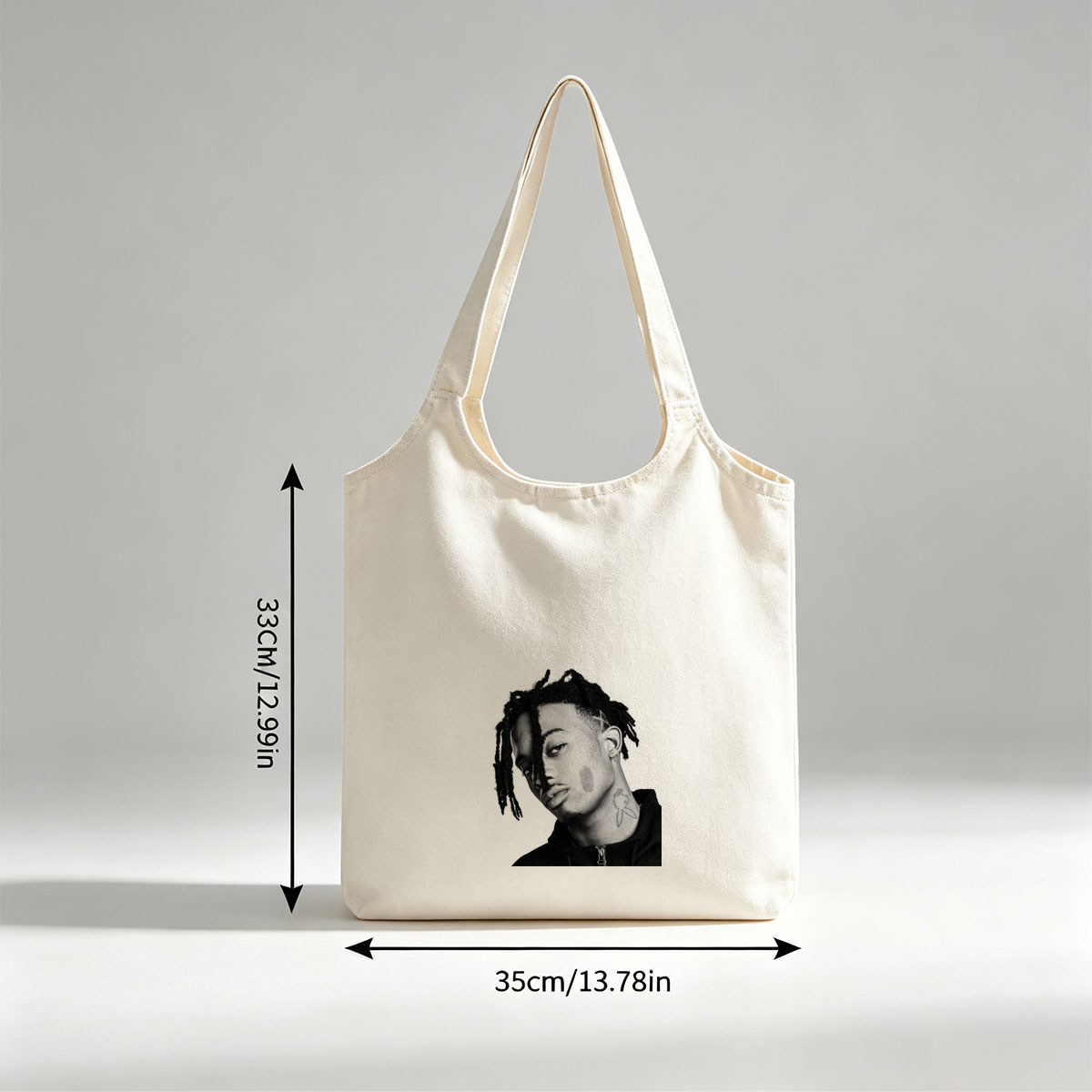 XXXTentacion in a striking black and white portrait with dreadlocks and neck tattoo, captured in a contemplative side profile. - Canvas shoulder bags/