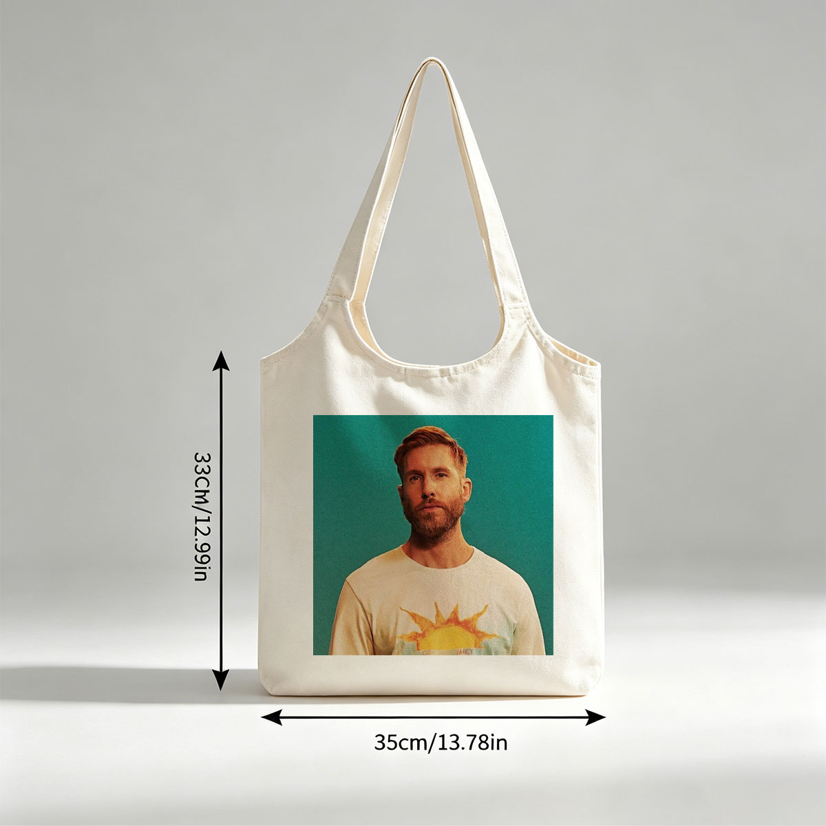 Calvin Harris in a Sun-Themed T-Shirt Against a Teal Background - Canvas shoulder bags/