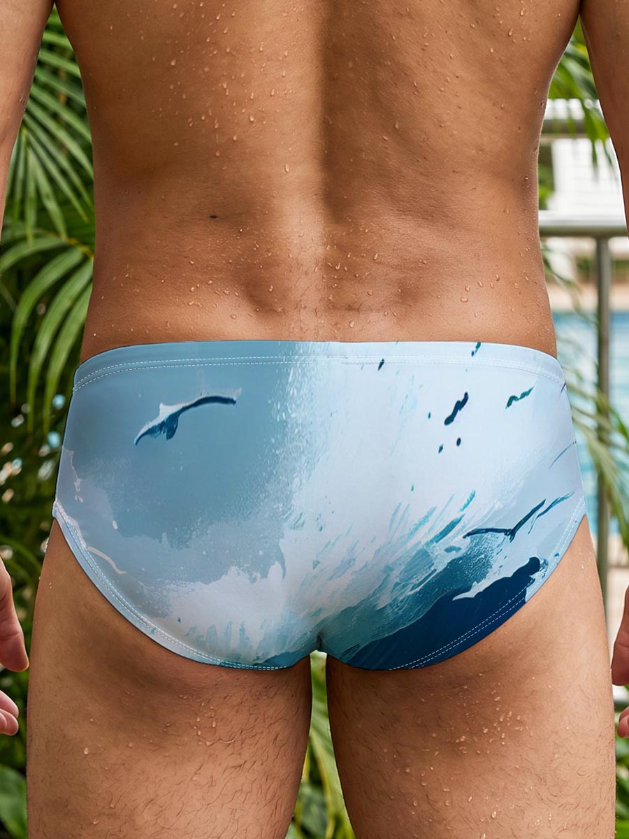 Mighty waves crash against rocks as seagulls soar above the stormy sea. -  Men's swim trunks