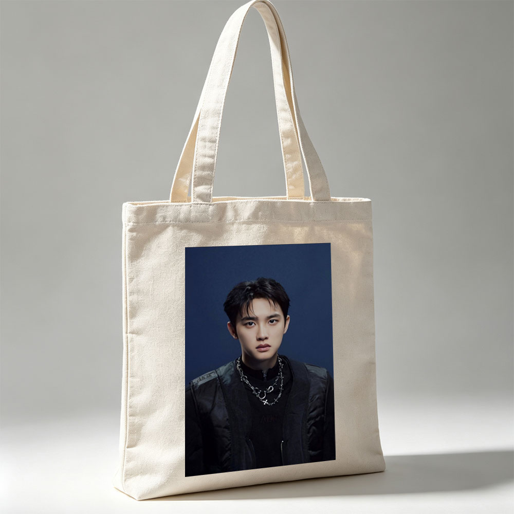 Do Kyung Soo in a Stylish Black Outfit with Layered Necklaces Against a Dark Blue Background - Canvas tote bags