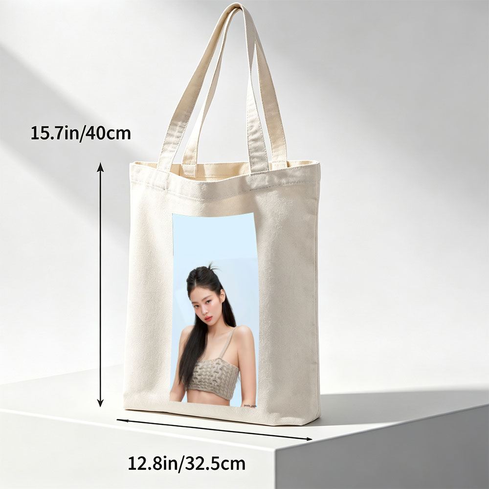 Jennie Kim in a Minimalist Look Wearing a Beige Knit Crop Top Against a Soft Blue Background - Canvas tote bags