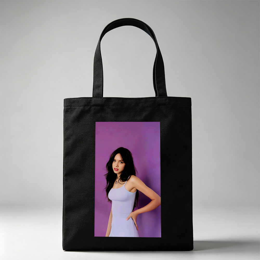 Olivia Rodrigo in a Light Blue Dress Posing Against Purple Background - Canvas tote bags