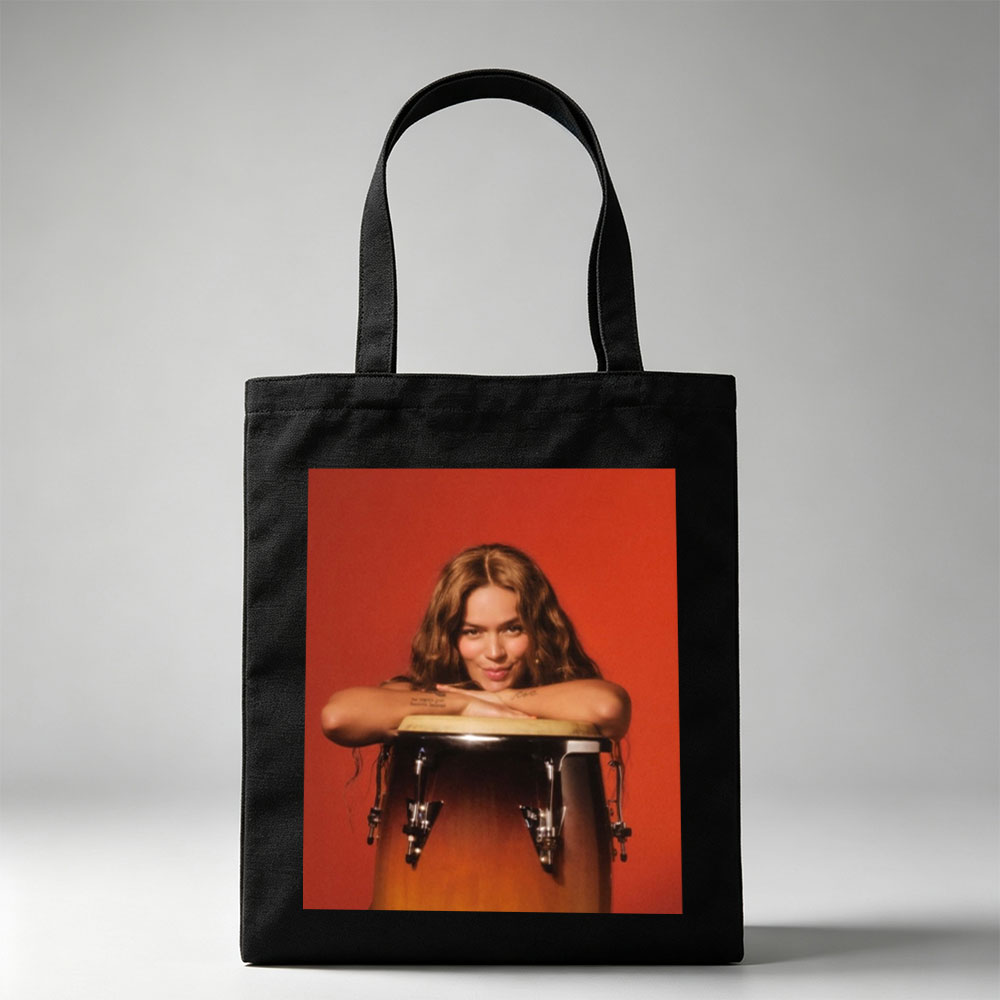 Maren Morris Leaning on a Conga Drum Against a Red Background - Canvas tote bags