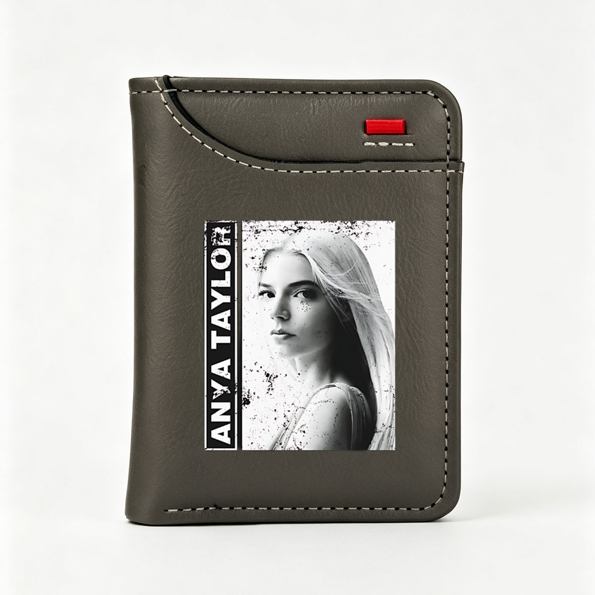 Anya Taylor-Joy in a striking black and white portrait with artistic splatter effects. - Vertical Style Wallet