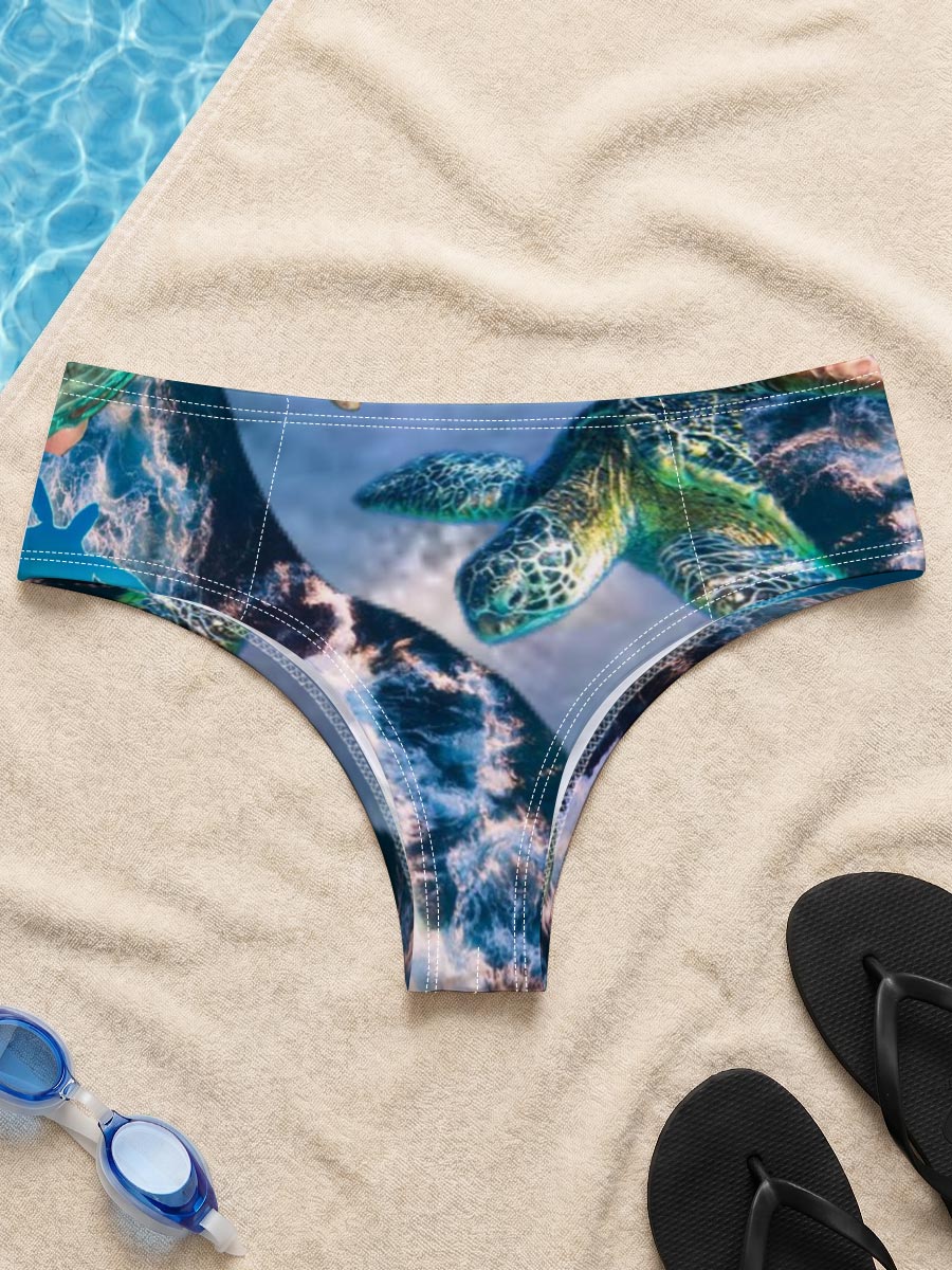 Turtles, stars, and flowers in a heart-filled ocean scene -  Men's swim trunks