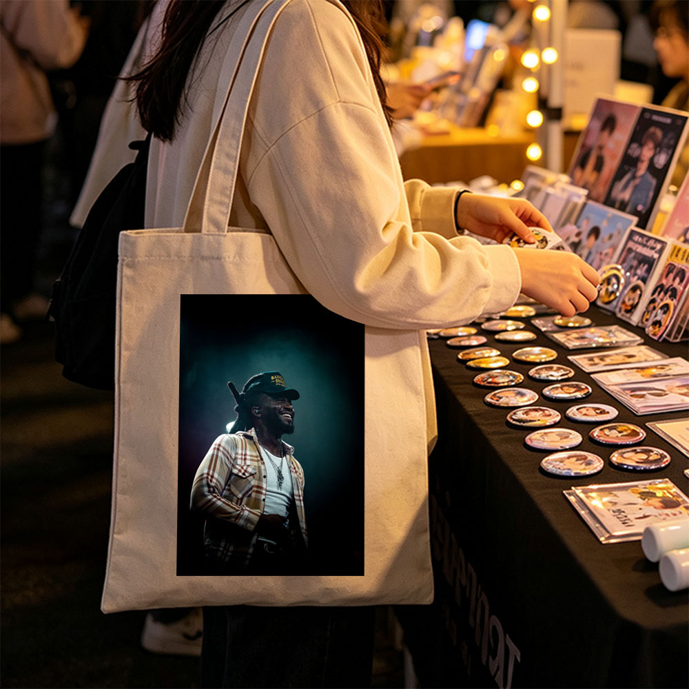 Burna Boy on Stage Performing with a Smile in a Plaid Shirt and Cap - Canvas tote bags
