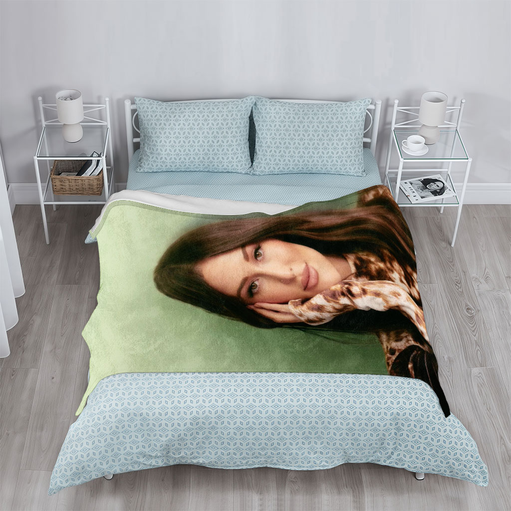 Kendall Rae - Portrait - Woman with Long Brown Hair Wearing Tie-Dye Top Against Green Background - Blankets