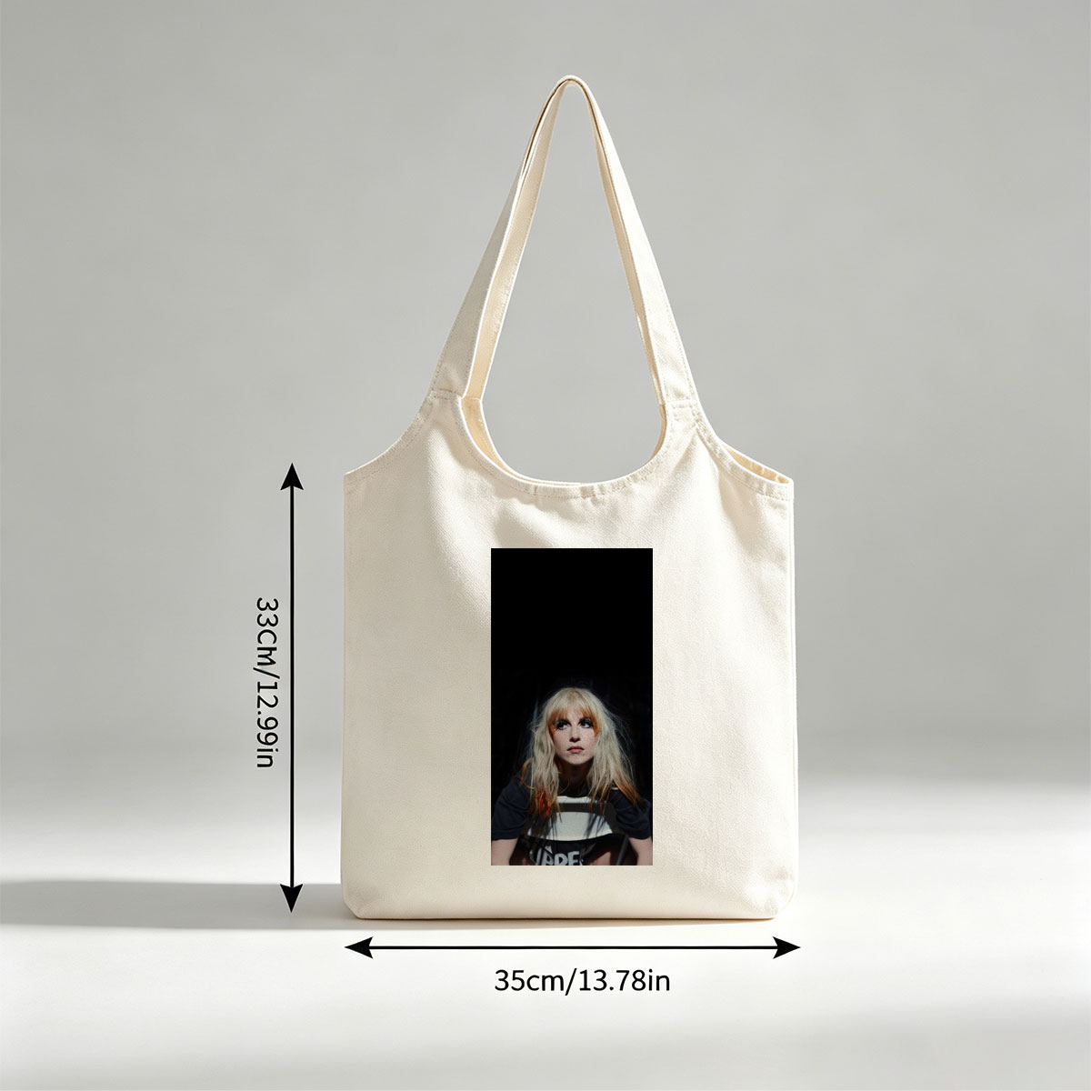 Hayley Williams in a Dramatic Portrait with Intense Gaze and Blonde Hair Against Dark Background - Canvas shoulder bags/