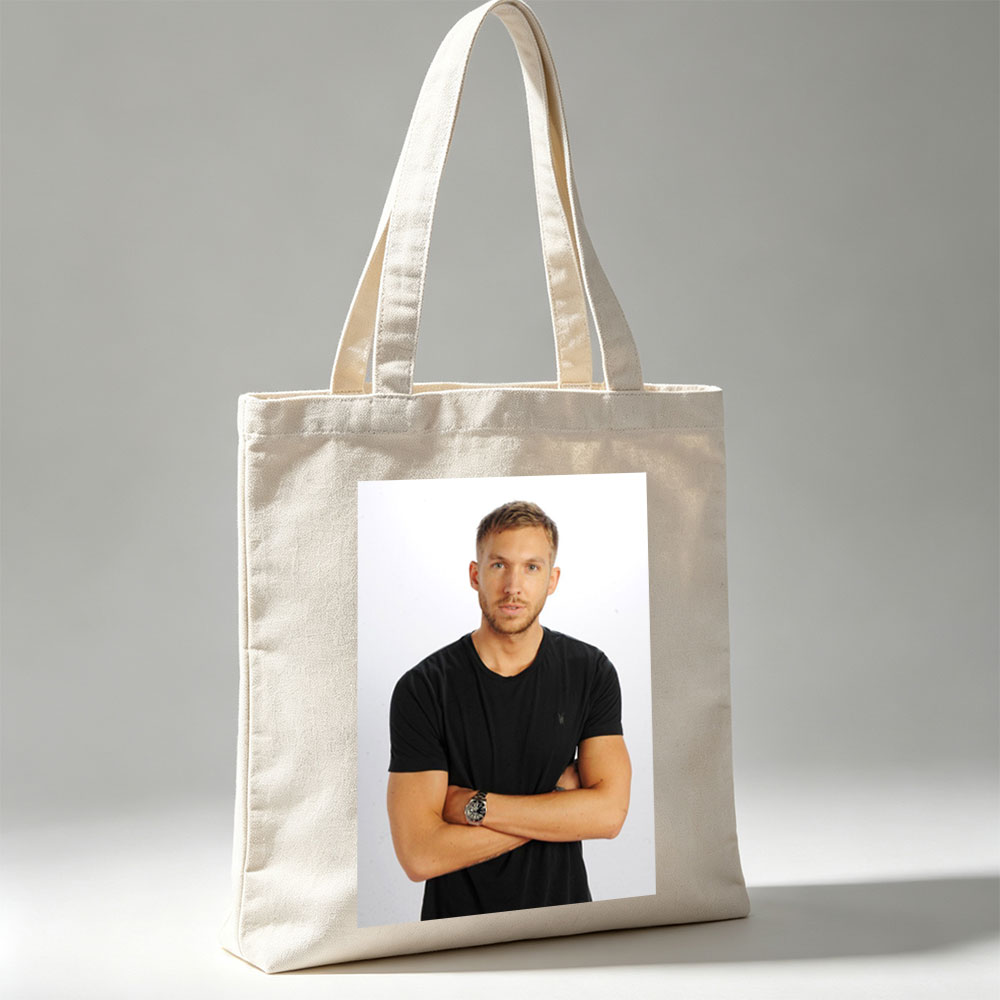 Calvin Harris Standing with Arms Crossed in Black T-Shirt Against White Background - Canvas tote bags