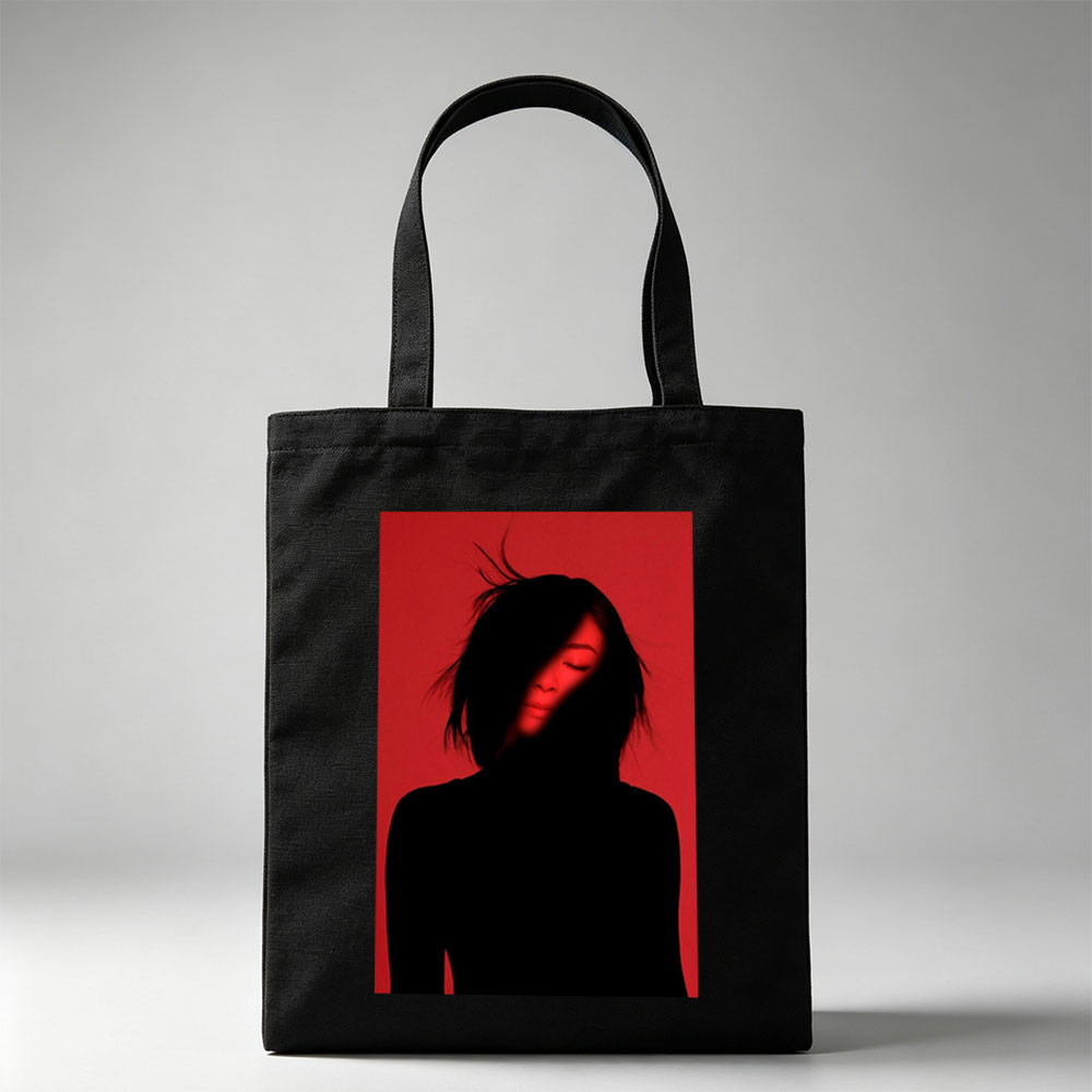Billie Eilish in a Dramatic Red-Lit Portrait with Silhouetted Features - Canvas tote bags