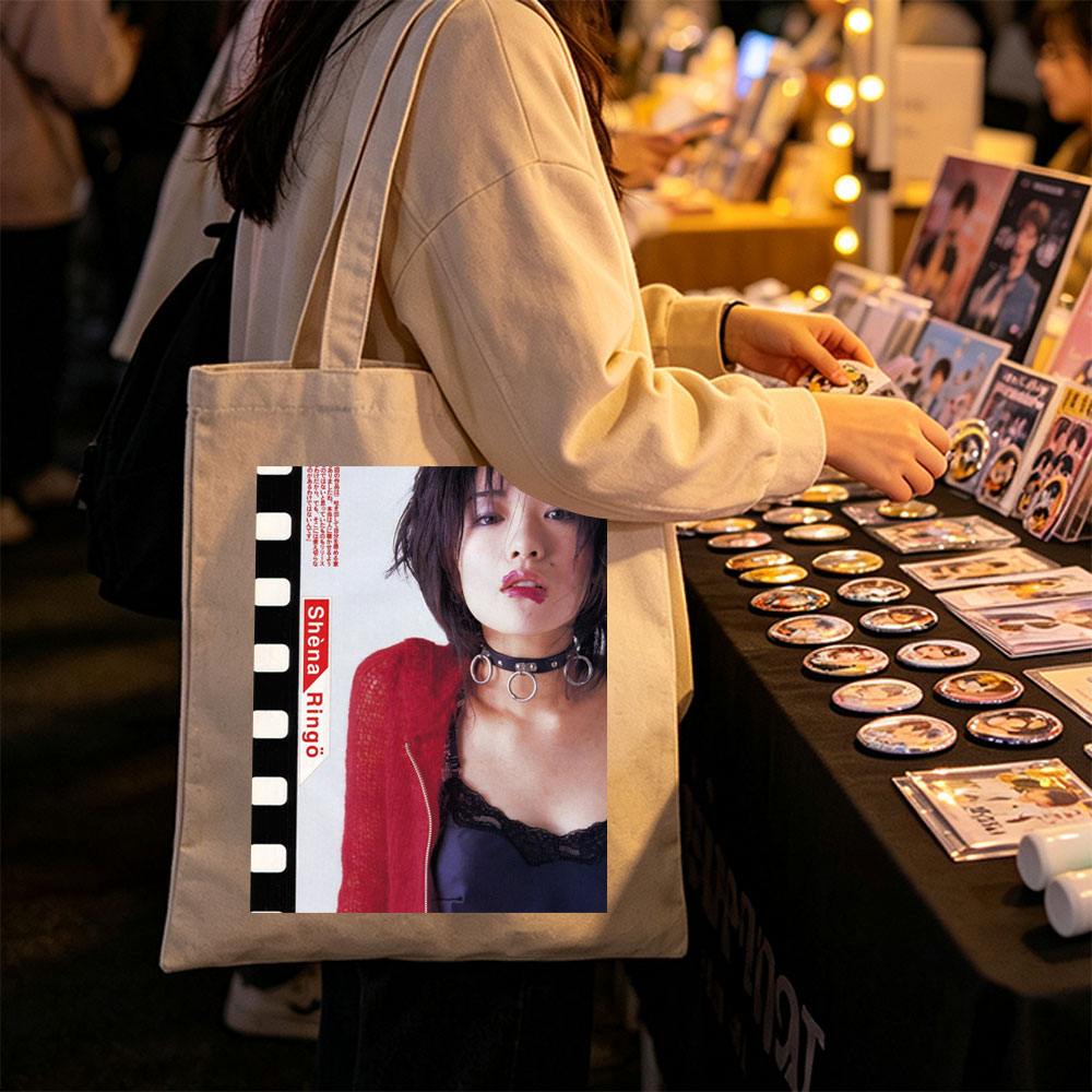Shena Ringo in a Bold Red Cardigan and Choker Necklace with Edgy Fashion Style - Canvas tote bags