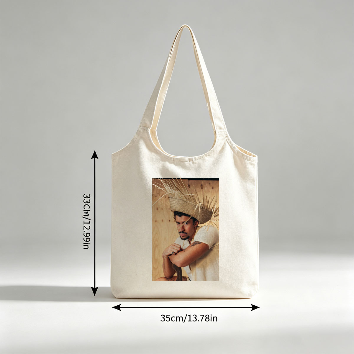 Bad Bunny Wearing a Straw Hat with Hay Sticks, Leaning Against a Wooden Wall in a Casual Pose - Canvas shoulder bags/