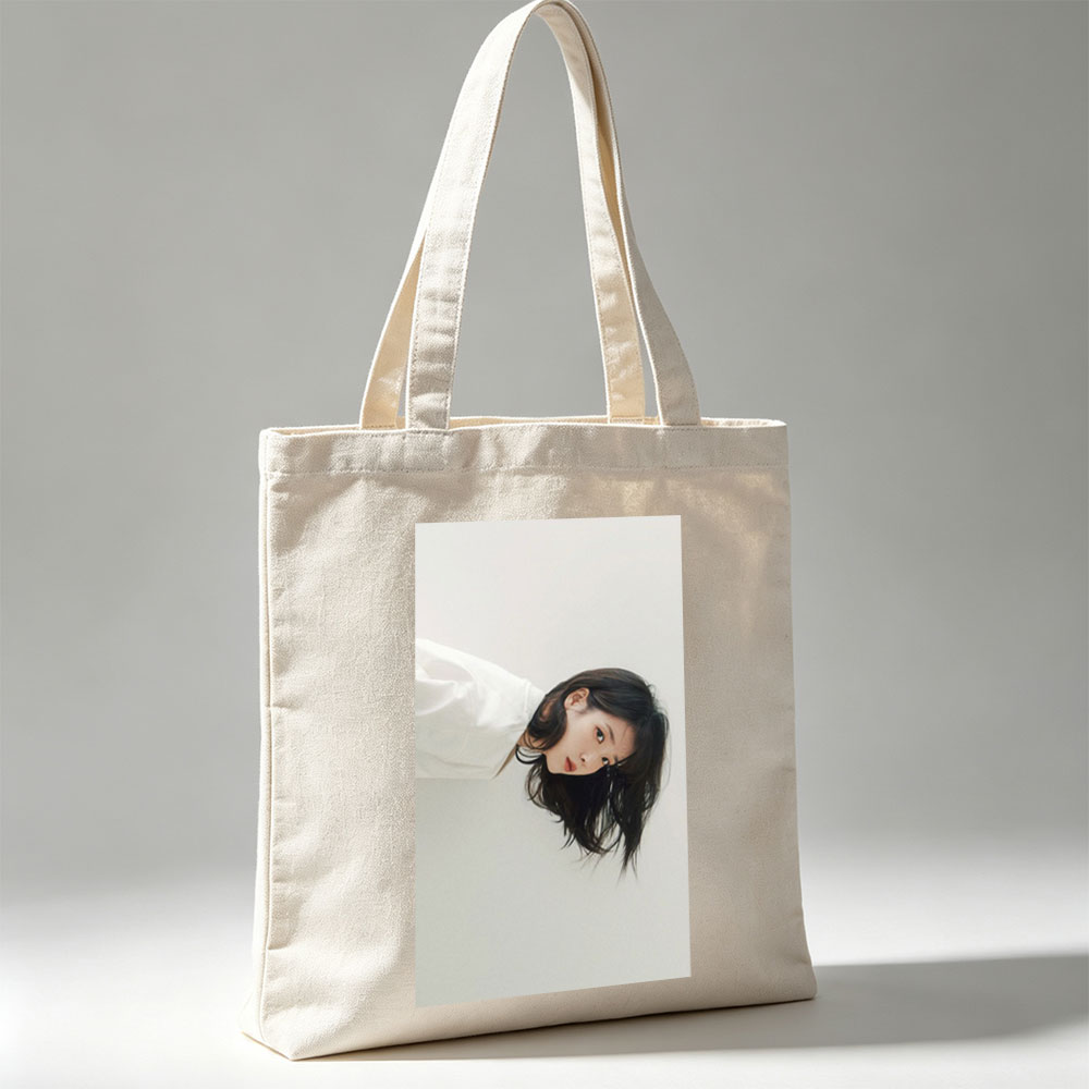 IU in a Minimalist Portrait with Soft Lighting and Neutral Background - Canvas tote bags