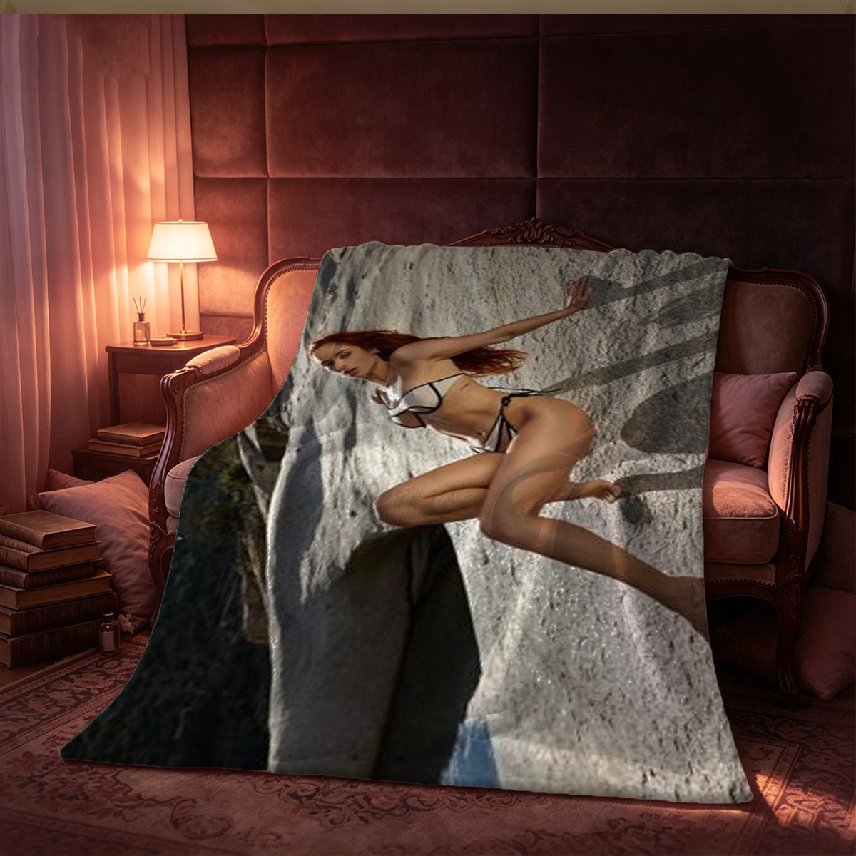 Redhead in white bodysuit lying on dark couch. - Blanket