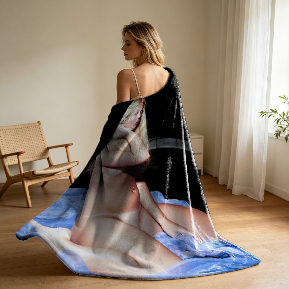 A seductive young woman in black and red lace lingerie with sheer stockings poses on a blue rug. - Blanket