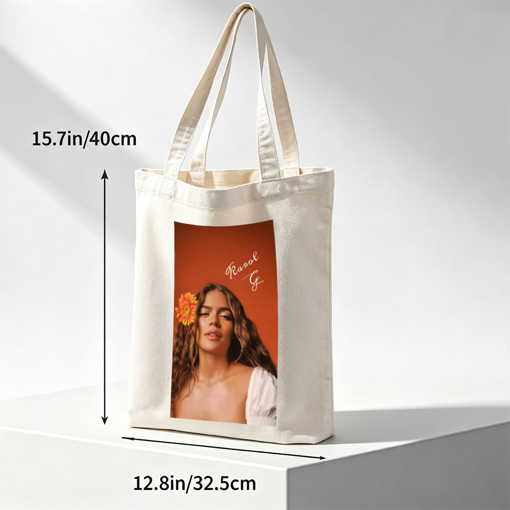 Ranal G with a vibrant orange flower in her hair against a warm terracotta background - Canvas tote bags