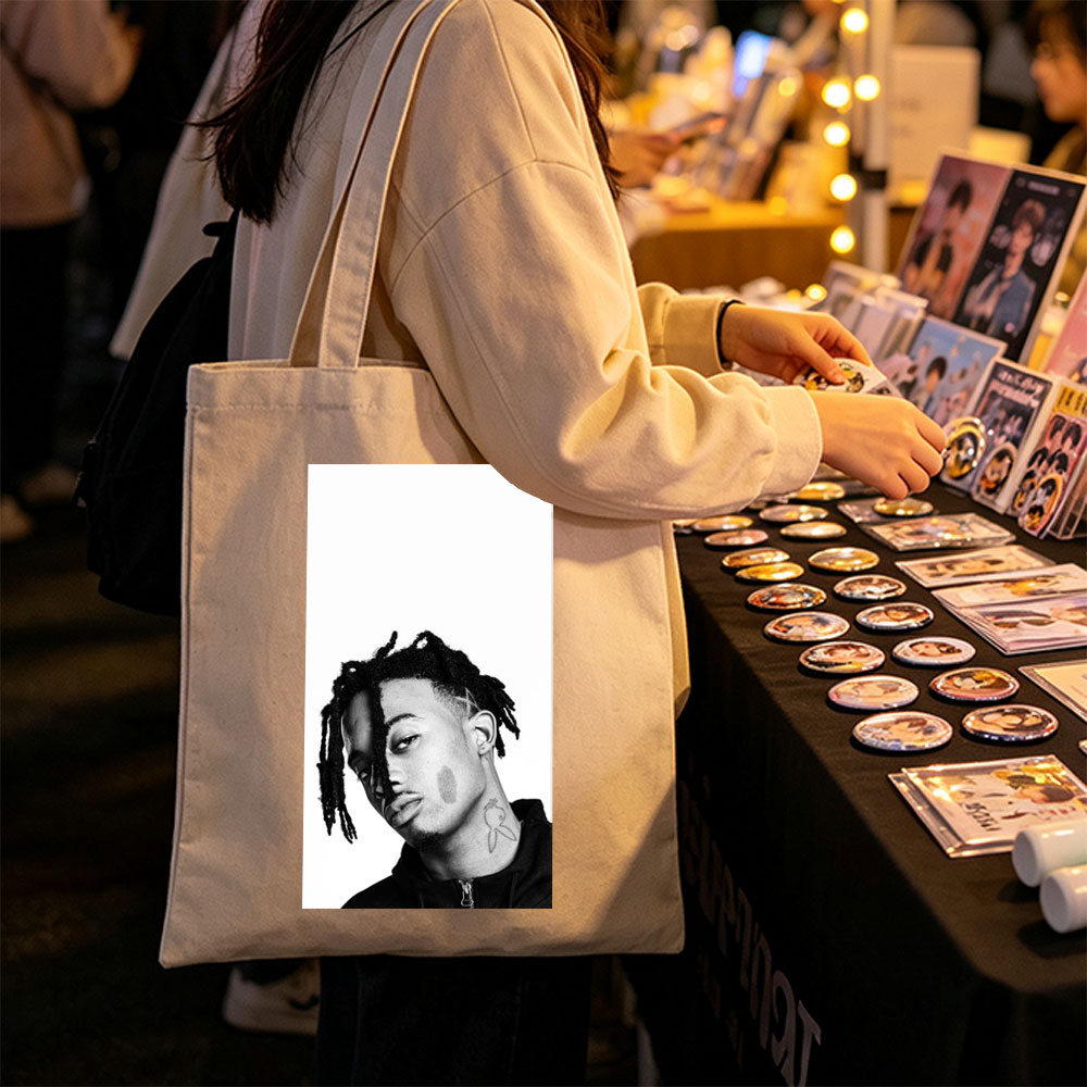 XXXTentacion in a striking black and white portrait with dreadlocks and neck tattoo, captured in a contemplative side profile. - Canvas tote bags