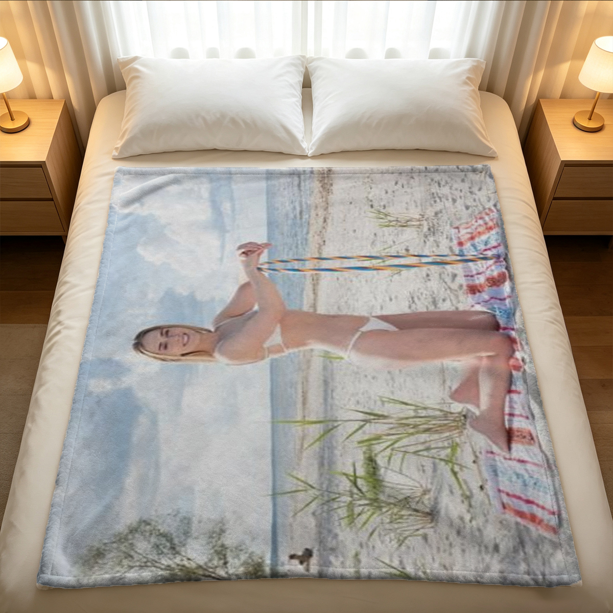Nude blonde kneeling on sofa smiling over shoulder - Blanket