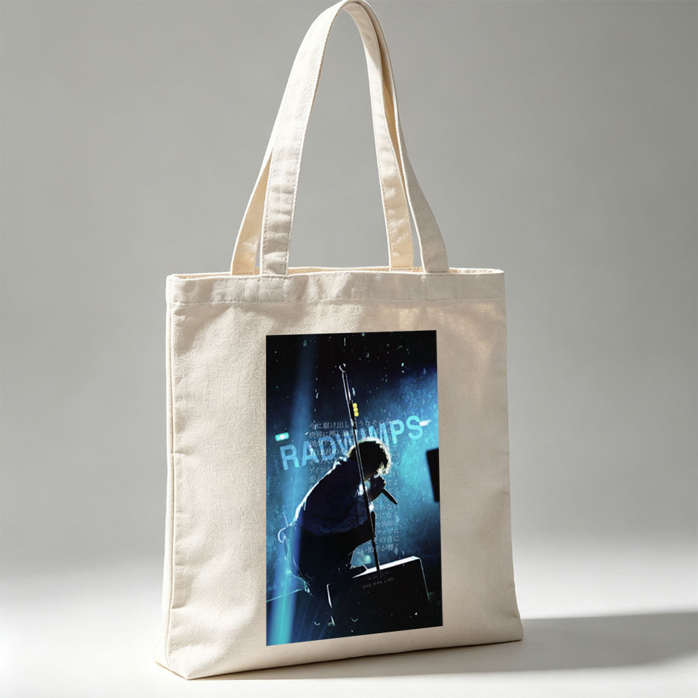 RADWIMPS Live Performance - Singer on Stage with Microphone and Dramatic Lighting - Canvas tote bags