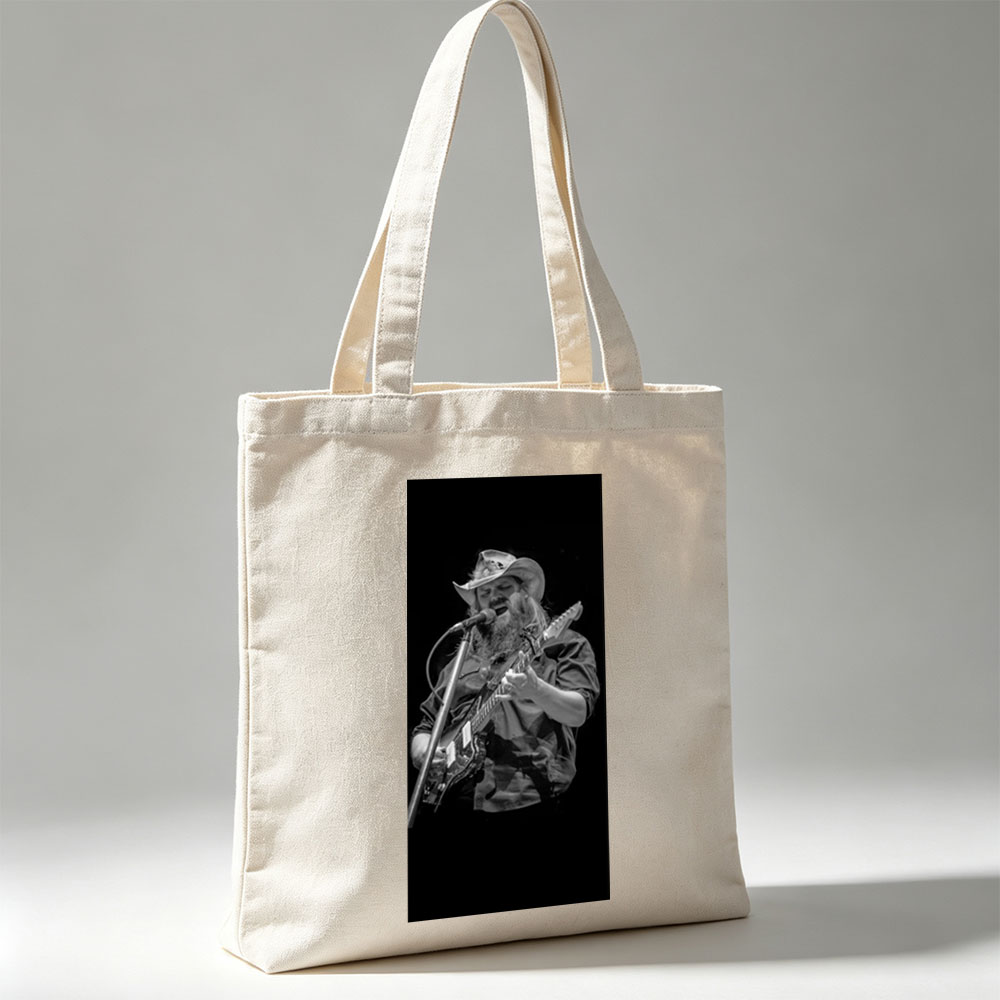 Chris Stapleton Performing Live with Guitar and Microphone on Stage - Canvas tote bags