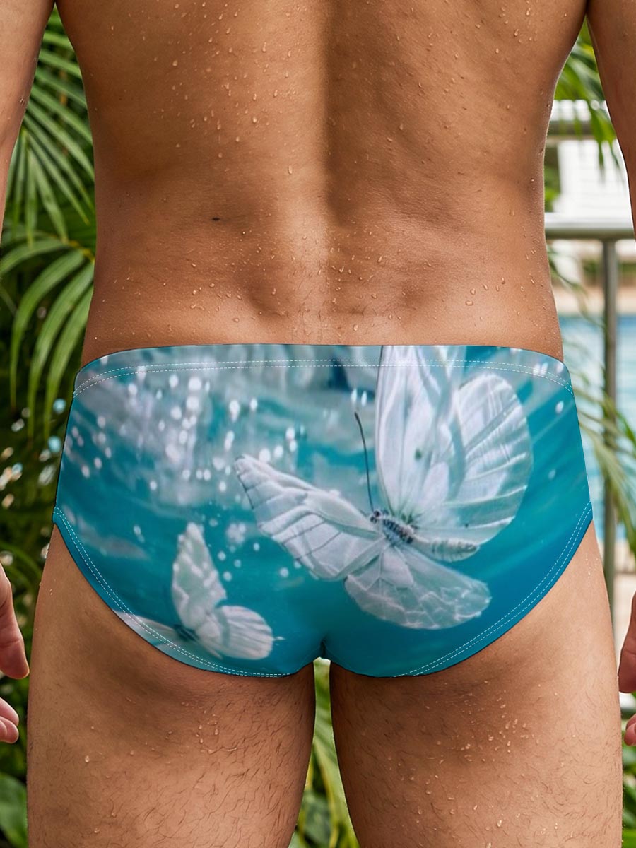 Butterflies floating underwater in clear blue water -  Men's swim trunks