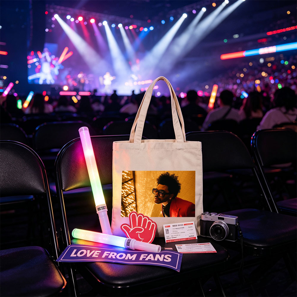 The Weeknd in a Red Suit and Sunglasses Against a Golden Lighted Background - Canvas tote bags