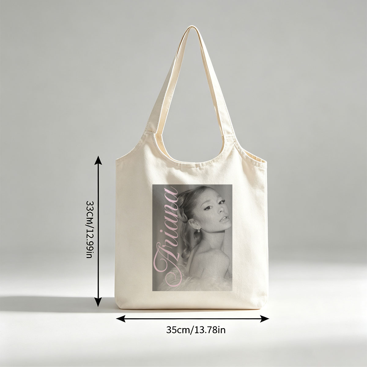Ariana Grande Elegant Black and White Portrait with Pink Text Overlay - Canvas shoulder bags/