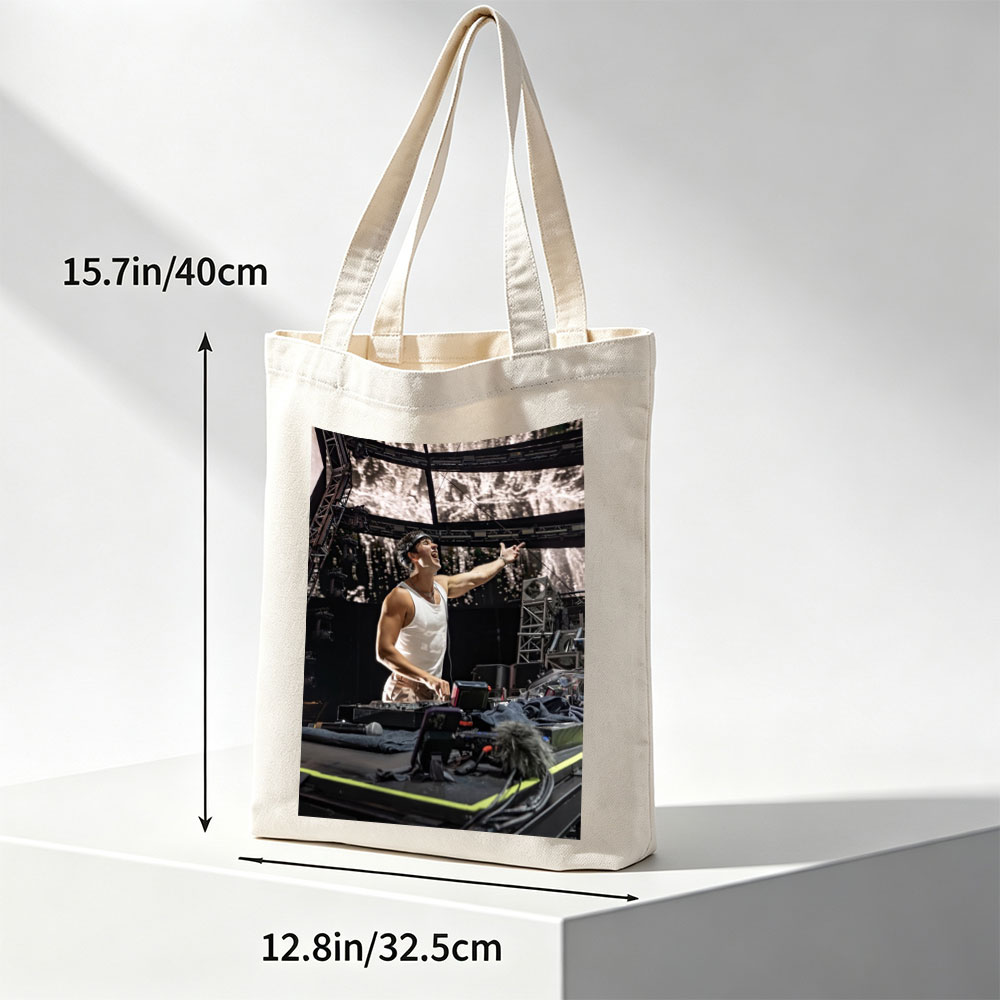 Martin Garrix Live Performance on Stage with DJ Equipment and Energetic Gesture - Canvas tote bags