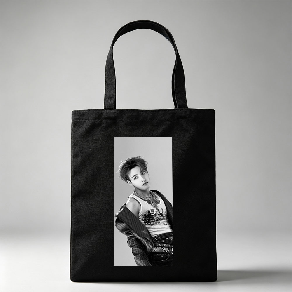 Dino from SEVENTEEN in a stylish black and white portrait wearing a graphic tank top and layered accessories. - Canvas tote bags