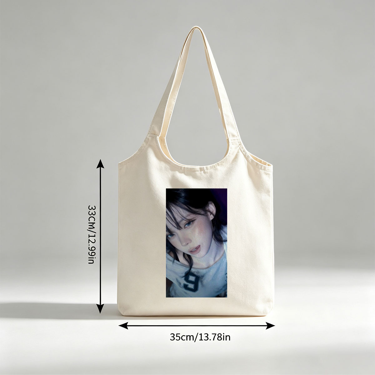Kim Ji-min in a Close-Up Portrait Wearing a Gray T-Shirt with Number 9 - Canvas shoulder bags/