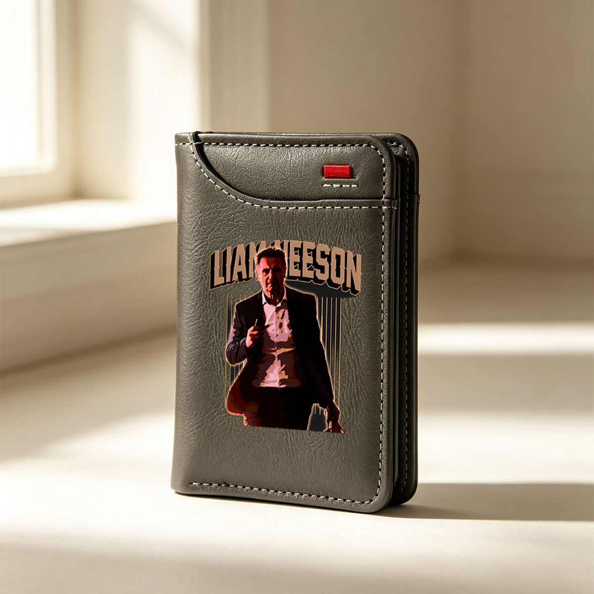 Liam Neeson in a dramatic pose, holding a phone, with bold text above him. - Vertical Style Wallet