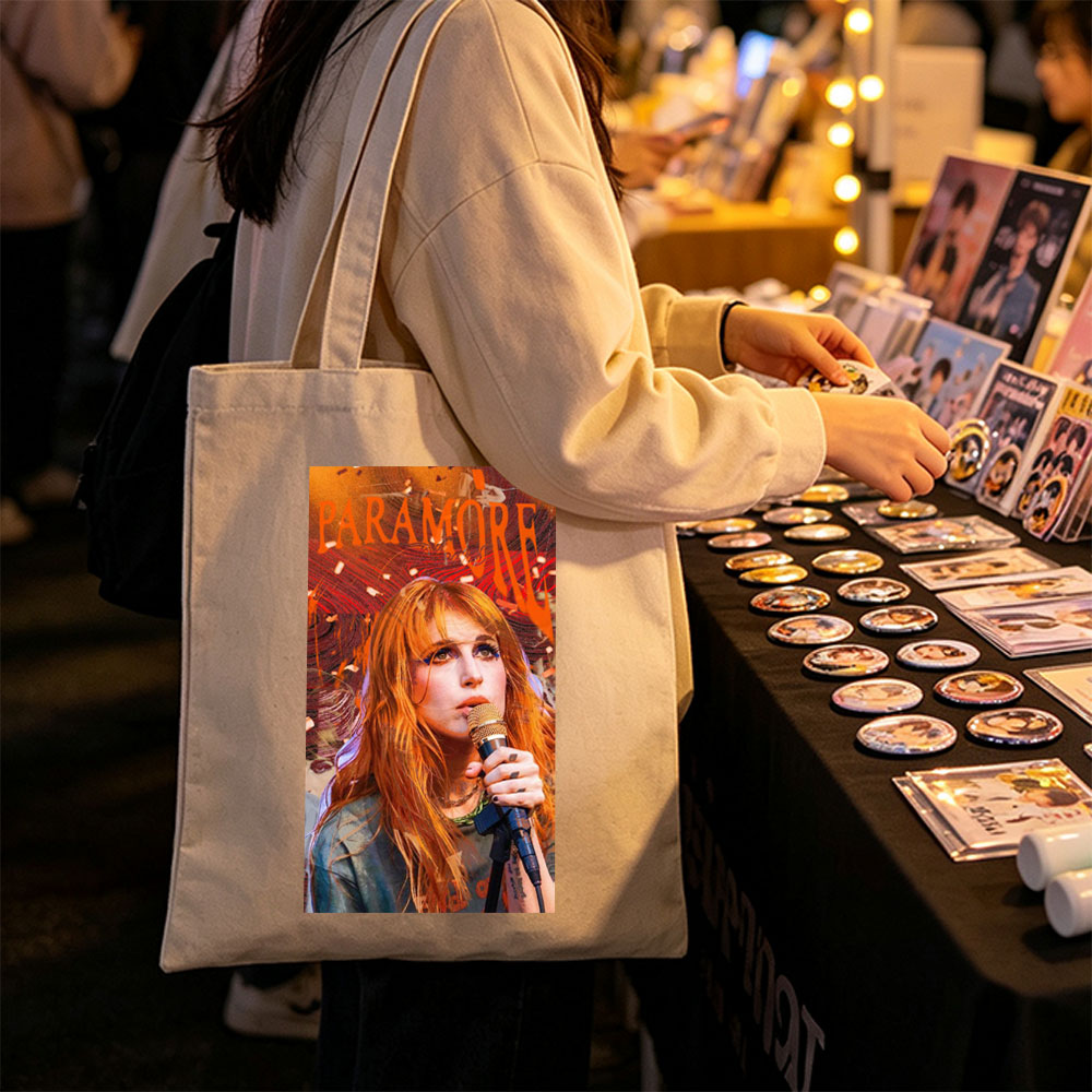 Paramore Live Performance - Hayley Williams Singing into Microphone with Vibrant Stage Background - Canvas tote bags