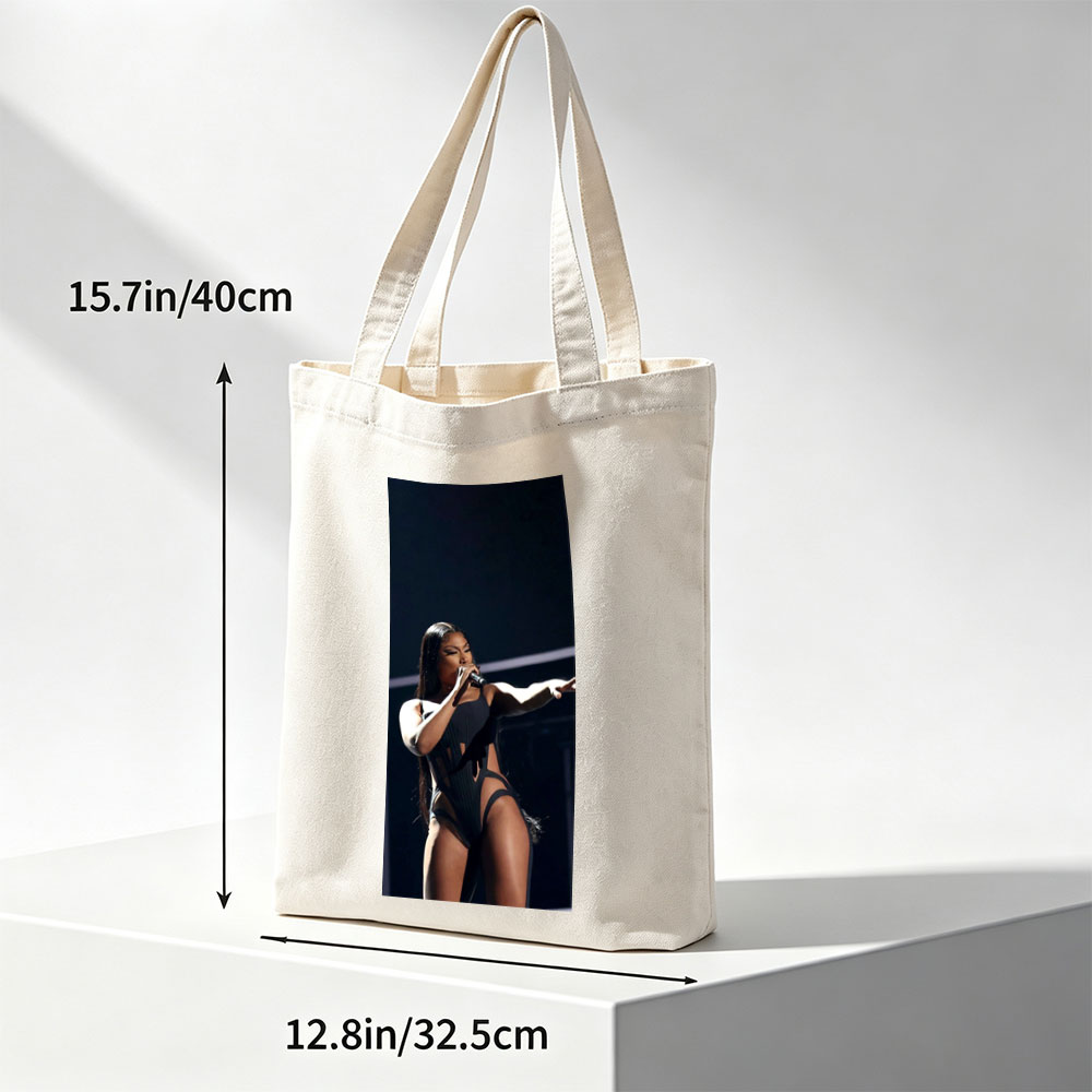 Cardi B Performing on Stage in a Black Bodysuit Holding a Microphone - Canvas tote bags