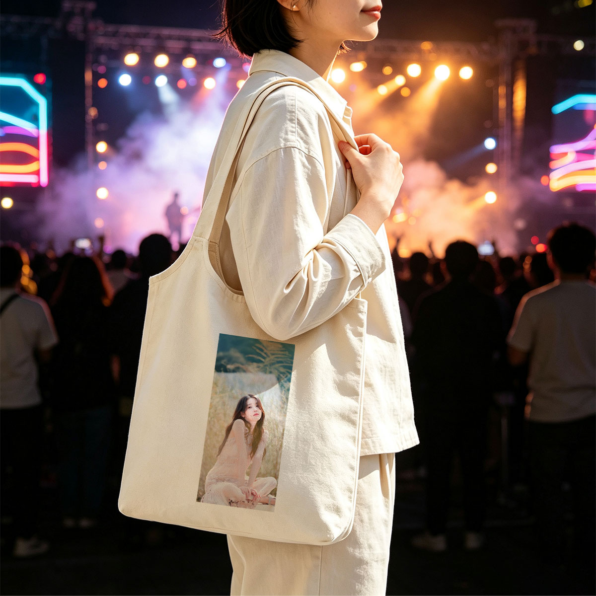 IU in a Serene Field Wearing a Delicate Pink Dress and Sitting Gracefully Amidst Tall Grass - Canvas shoulder bags/