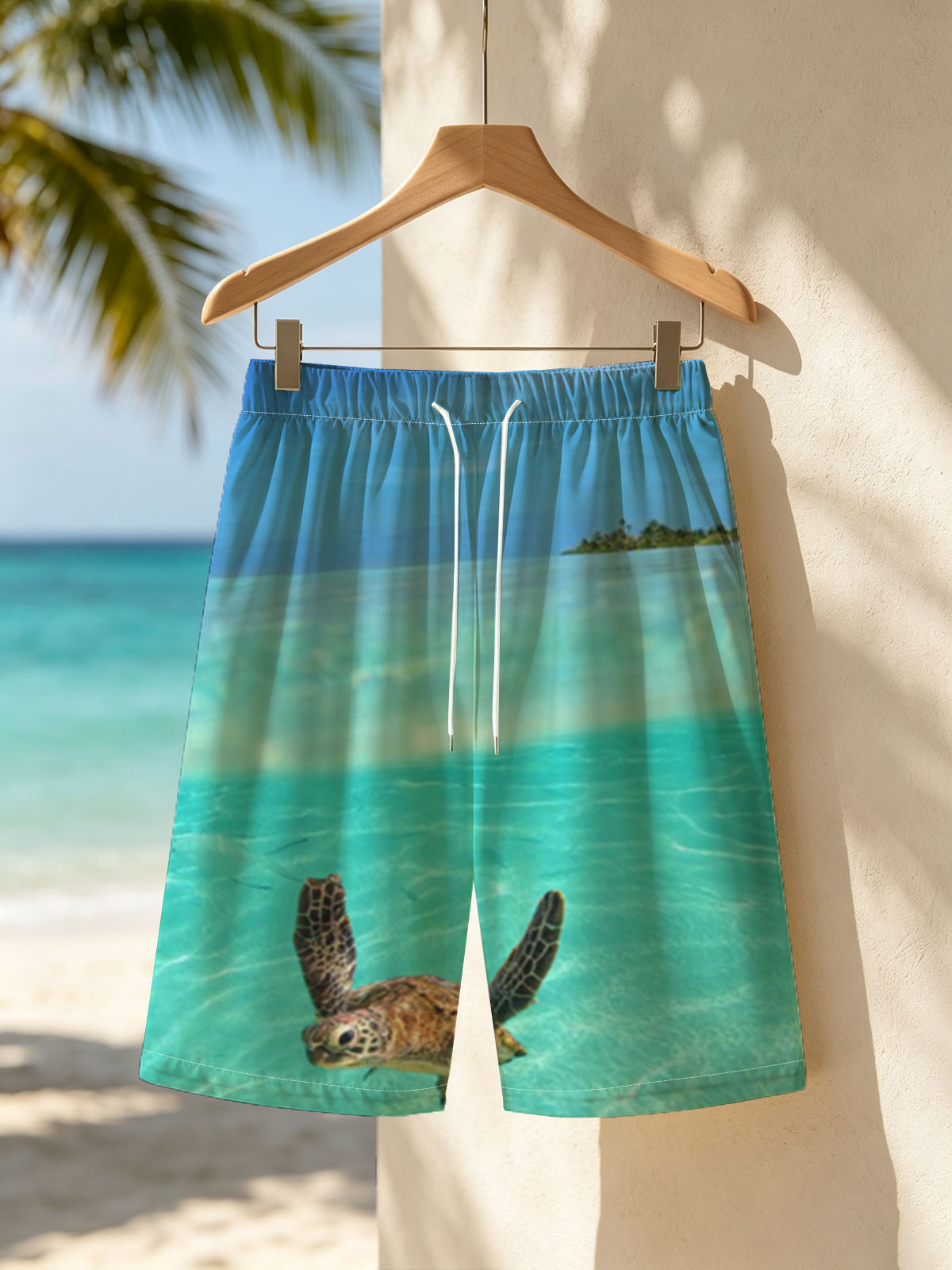 Sea turtle swims in crystal-clear turquoise waters near a tropical island. -  Beach shorts