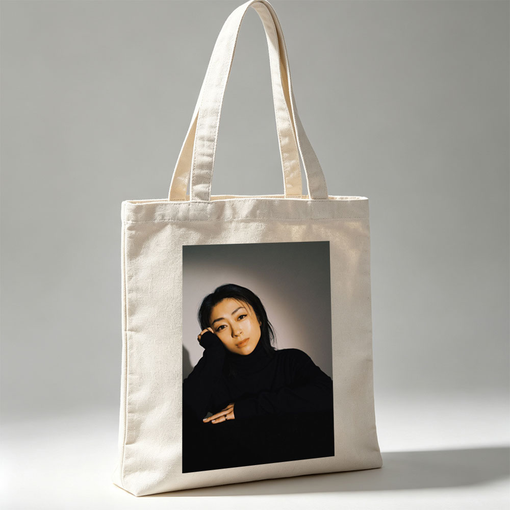 Yoko Kanno in a Moody Portrait Wearing Black Turtleneck with Dramatic Lighting - Canvas tote bags