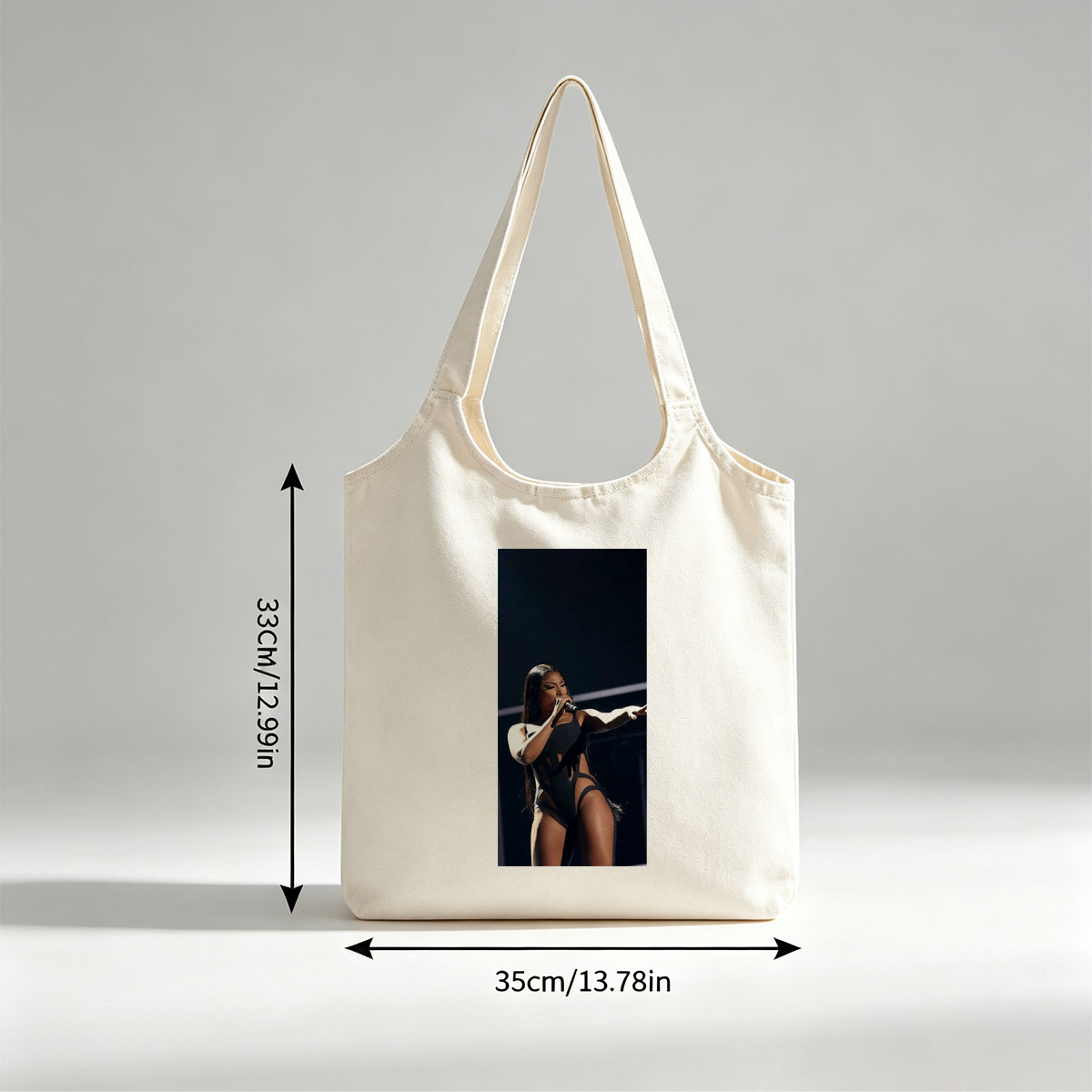 Cardi B Performing on Stage in a Black Bodysuit Holding a Microphone - Canvas shoulder bags/
