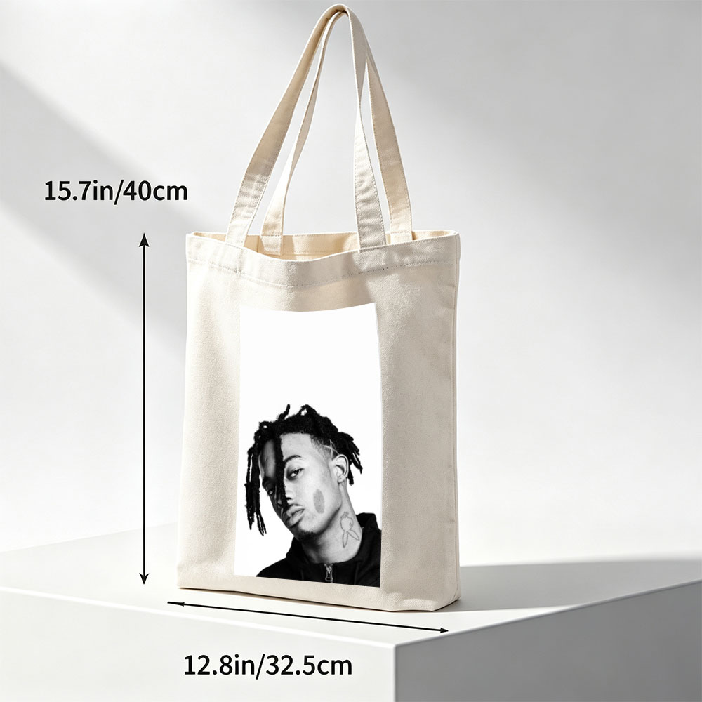 XXXTentacion in a striking black and white portrait with dreadlocks and neck tattoo, captured in a contemplative side profile. - Canvas tote bags
