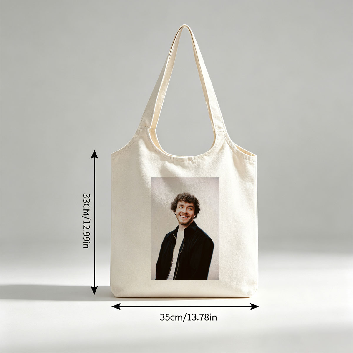 Matt Healy of The 1975 in a Candid Moment Wearing a Black Jacket and White Shirt Against a Plain Background - Canvas shoulder bags/