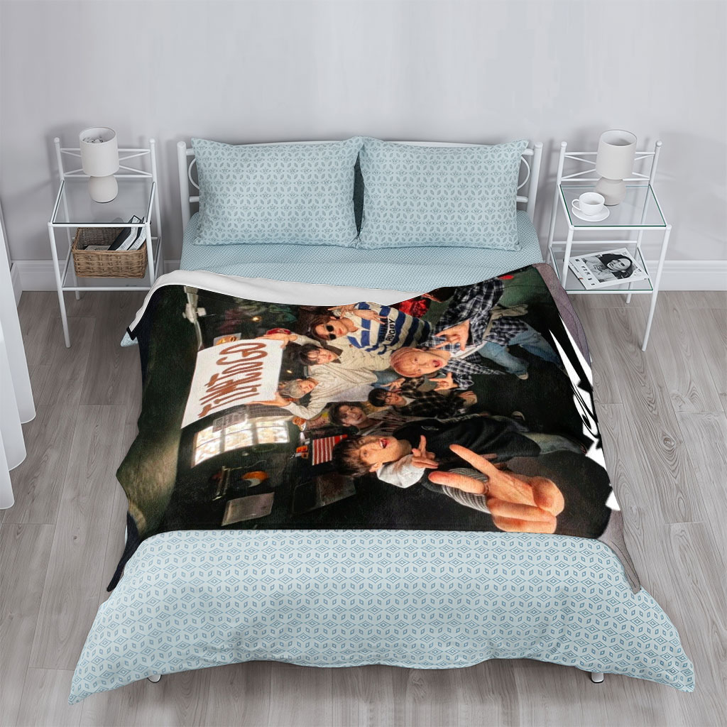 NCT DREAM in a cozy room holding a 