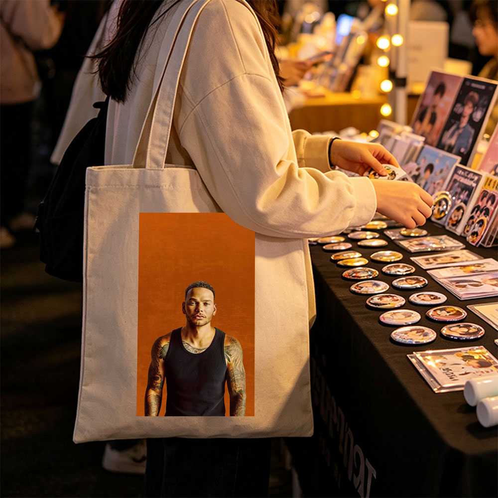 Liam Payne Standing in Black Tank Top with Visible Tattoos Against Orange Background - Canvas tote bags