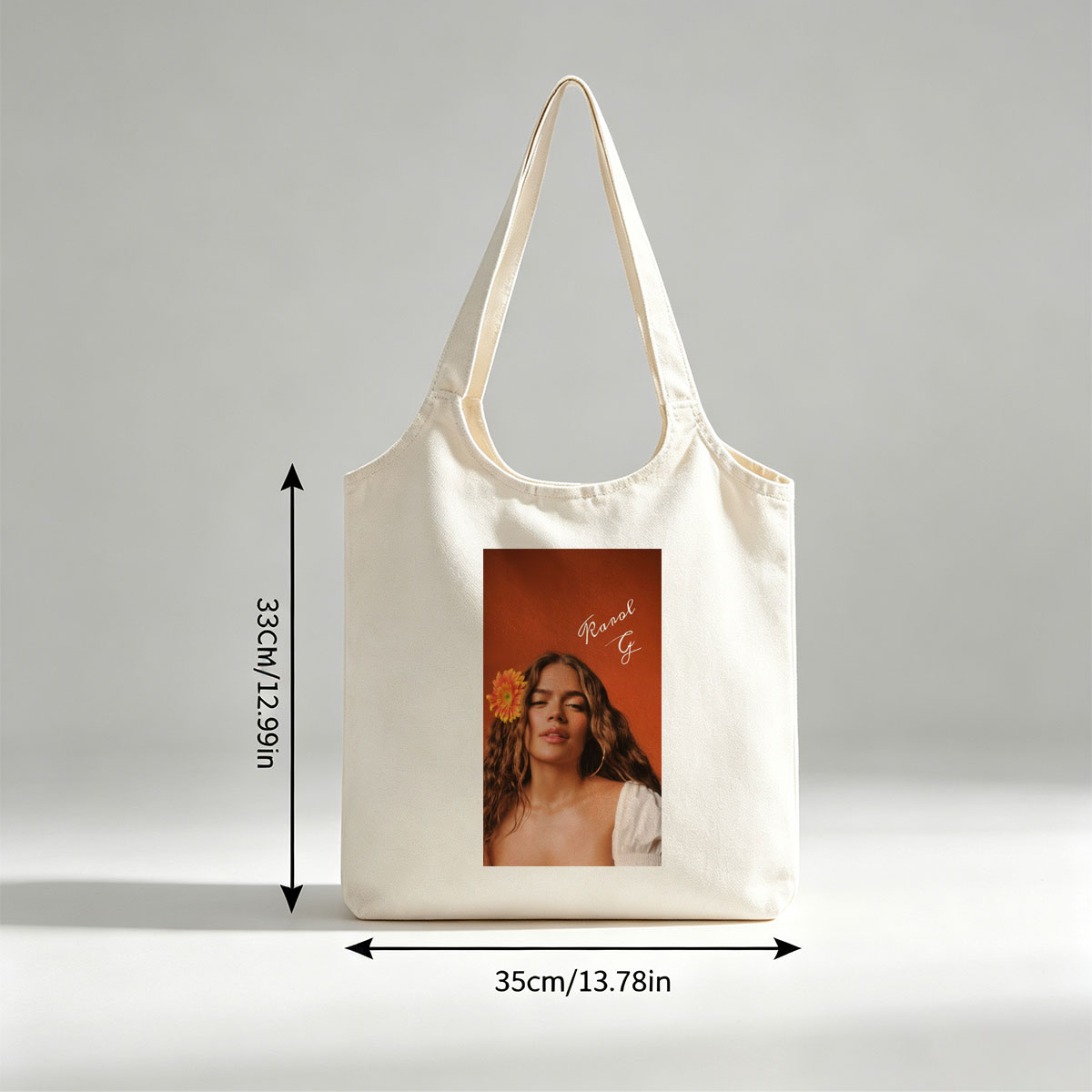 Ranal G with a vibrant orange flower in her hair against a warm terracotta background - Canvas shoulder bags/