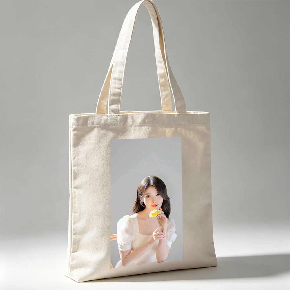 IU Holding a Yellow Rose in a Soft White Dress - Canvas tote bags
