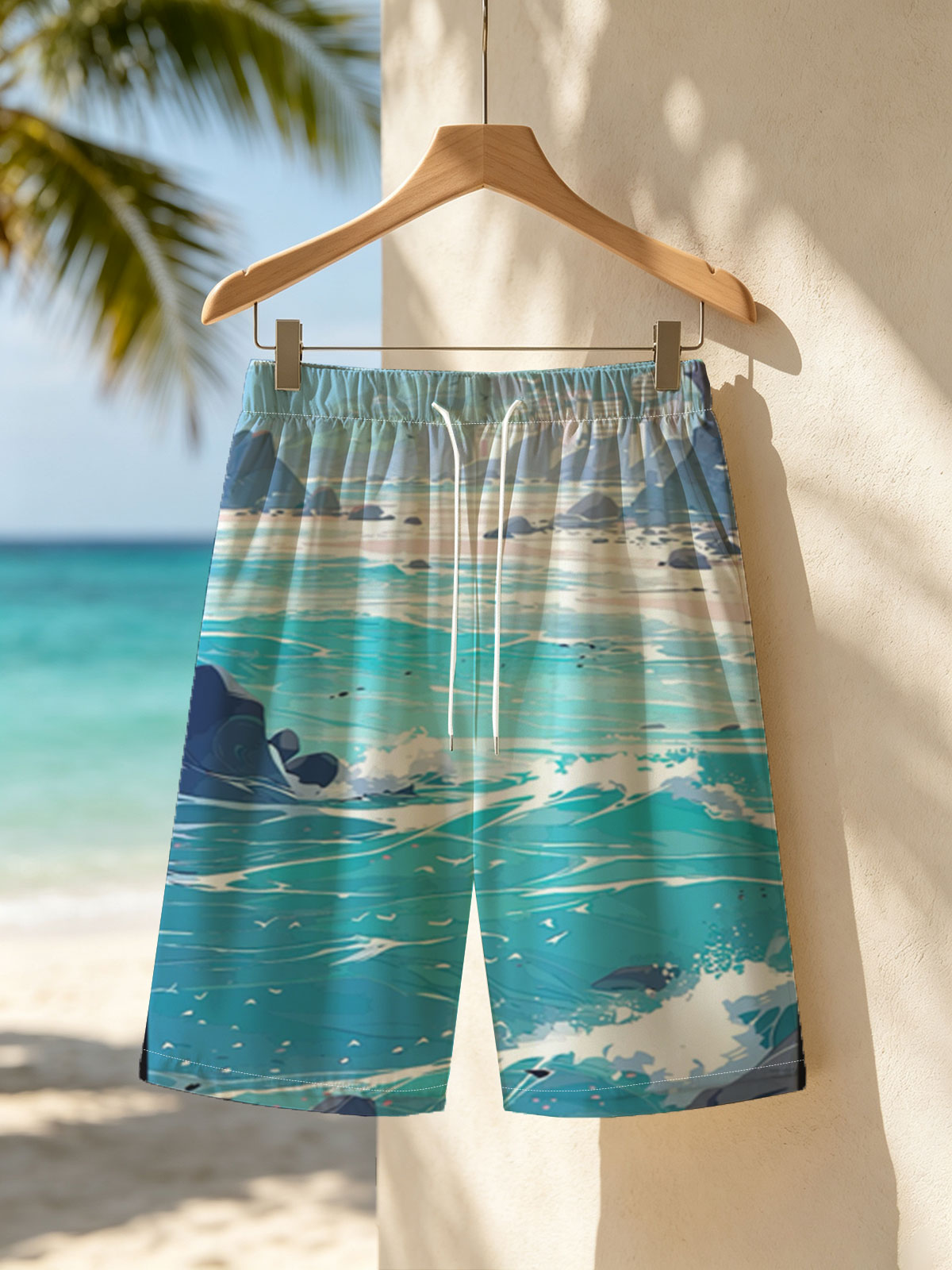 Turquoise waves crash on a rocky beach with distant city skyline and lush green hills under a bright sky. -  Beach shorts