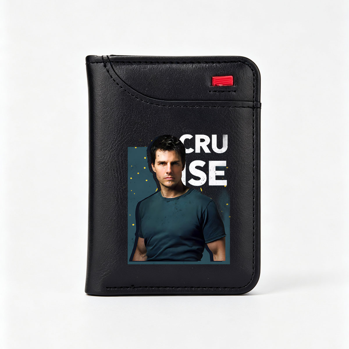 Tom Cruise in a dark blue t-shirt, intense gaze, bold text 