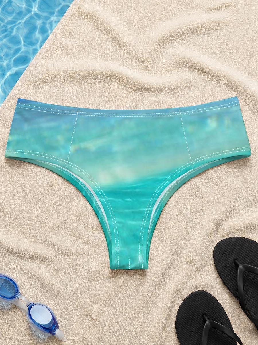 Sea turtle swims in crystal-clear turquoise waters near a tropical island. -  Men's swim trunks