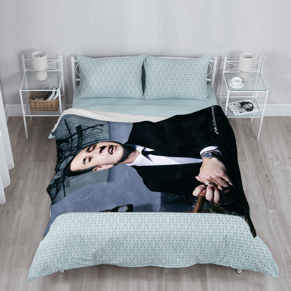 Pete Davidson in a Suit Holding a Cigar with Artwork in the Background - Blankets